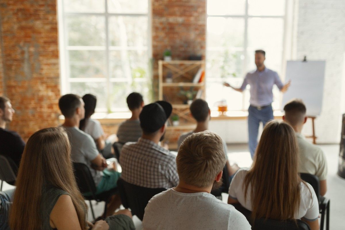 Leadership coach guiding professionals during a leadership coaching session